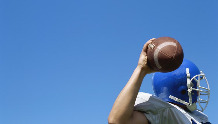 football player throwing a football