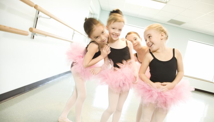 Girls in ballet class posing together