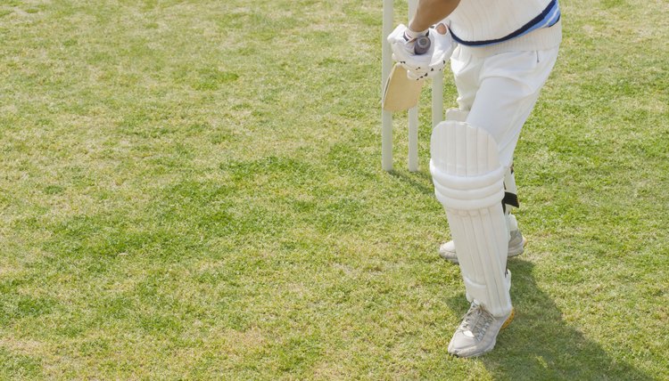 Cricket batsman playing a defensive stroke