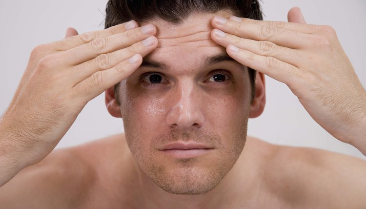 Man applying moisturizer