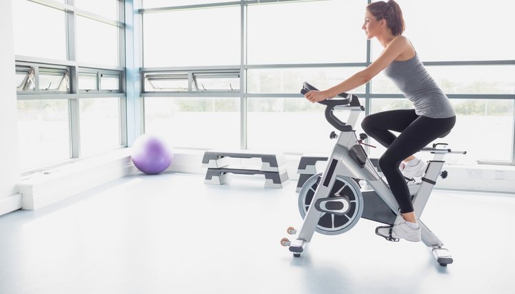 Woman riding an exercise bike