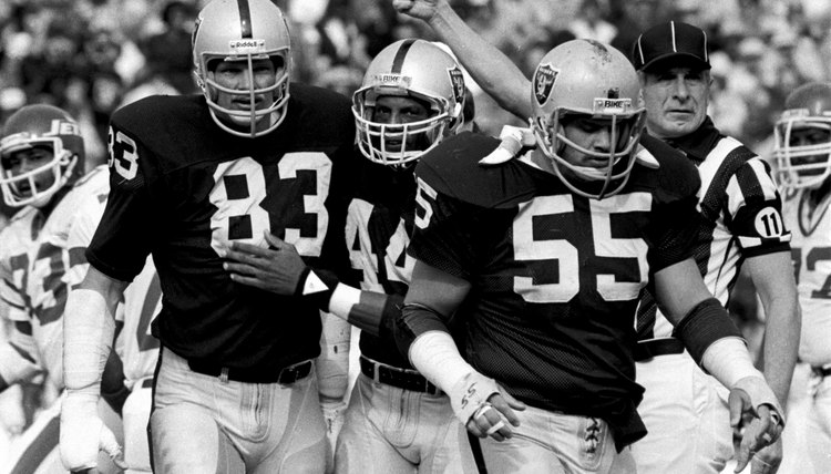 Ted Hendricks recovers fumble during AFC Playoffs game