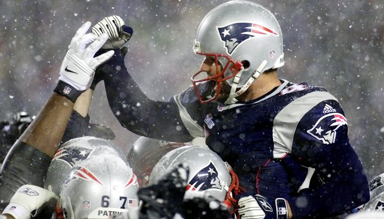 Field kicker Adam Vinatieri (L) of the New England